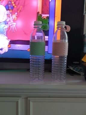 Clear Reusable Water Bottle Pair with Green and Blush Silicone Grips